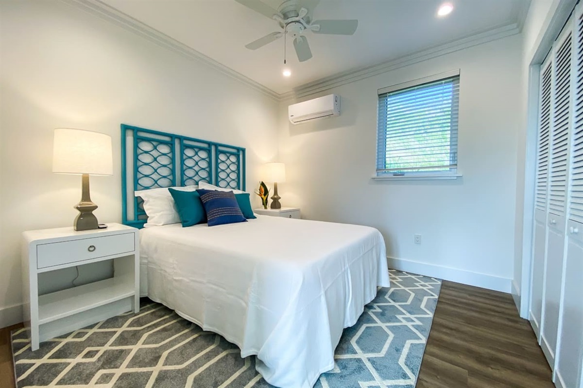 Bedroom 2 with queen bed and calming colors.