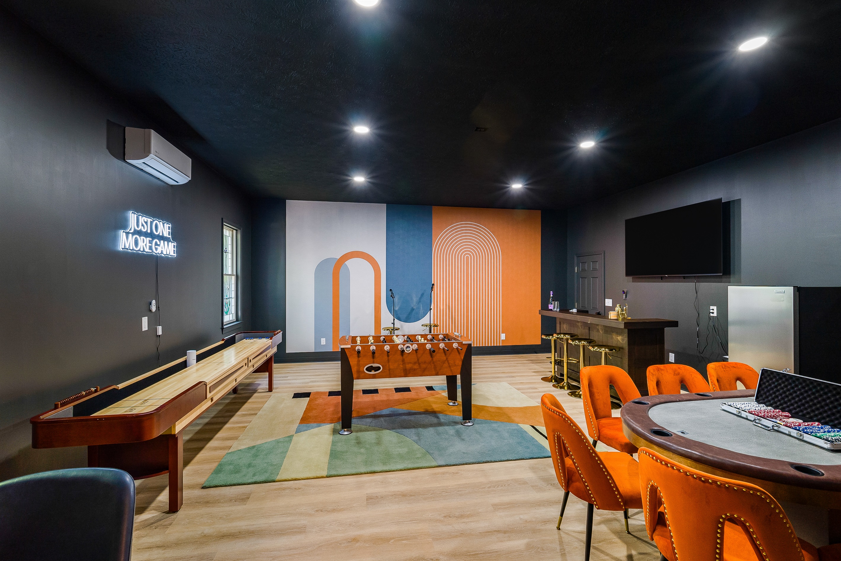 A dedicated game room where the fun never ends — shuffleboard, foosball, poker, and a bar make it the ultimate hangout spot.