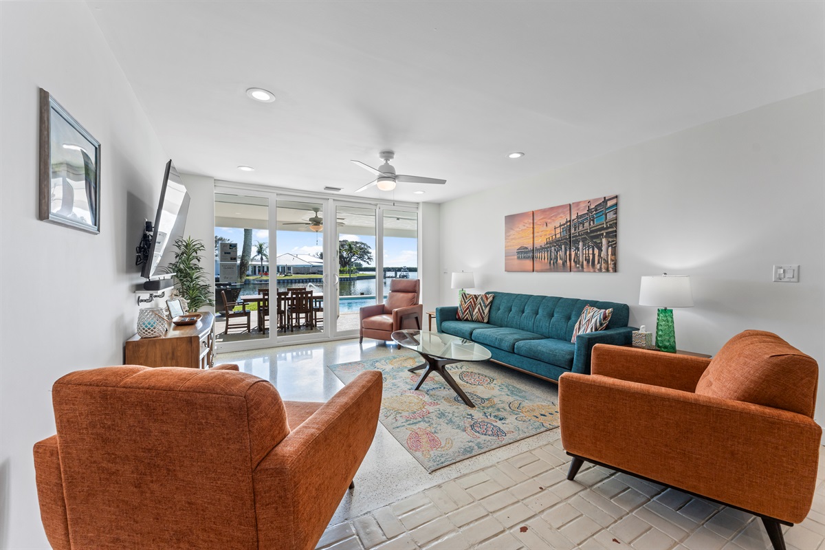Living room has huge sliding doors to the patio and pool area