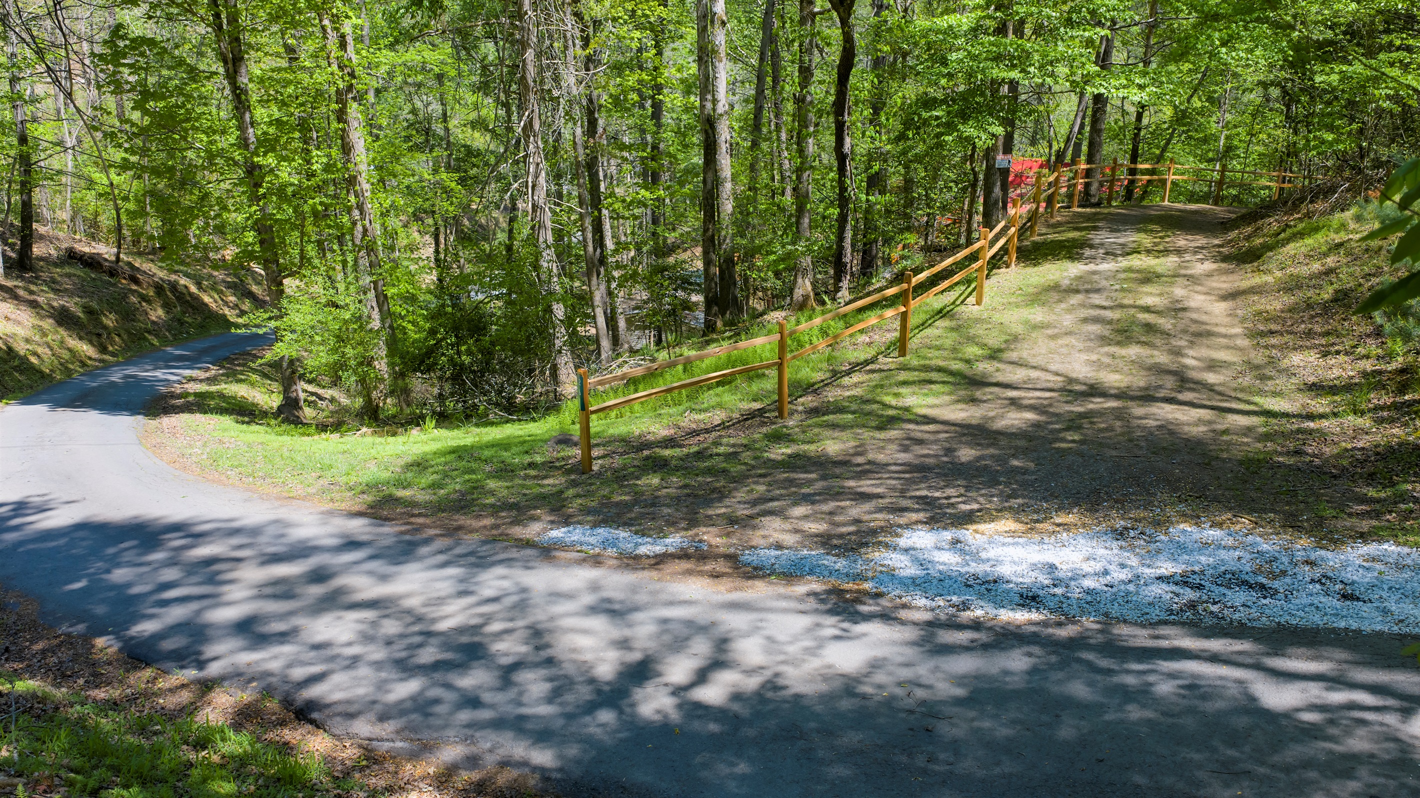 Turn in from Laurel Cove Rd and follow the driveway into your private, wooded retreat.