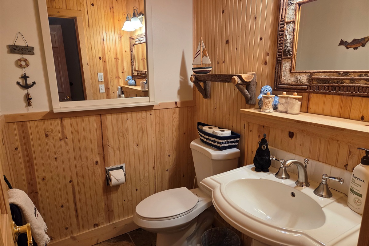 This bathroom is located in the hallway outside of the bunk room.  It has a shower, toilet and sink.  All bathrooms have basic toiletries, toilet paper and both shower and hand towels for your use.