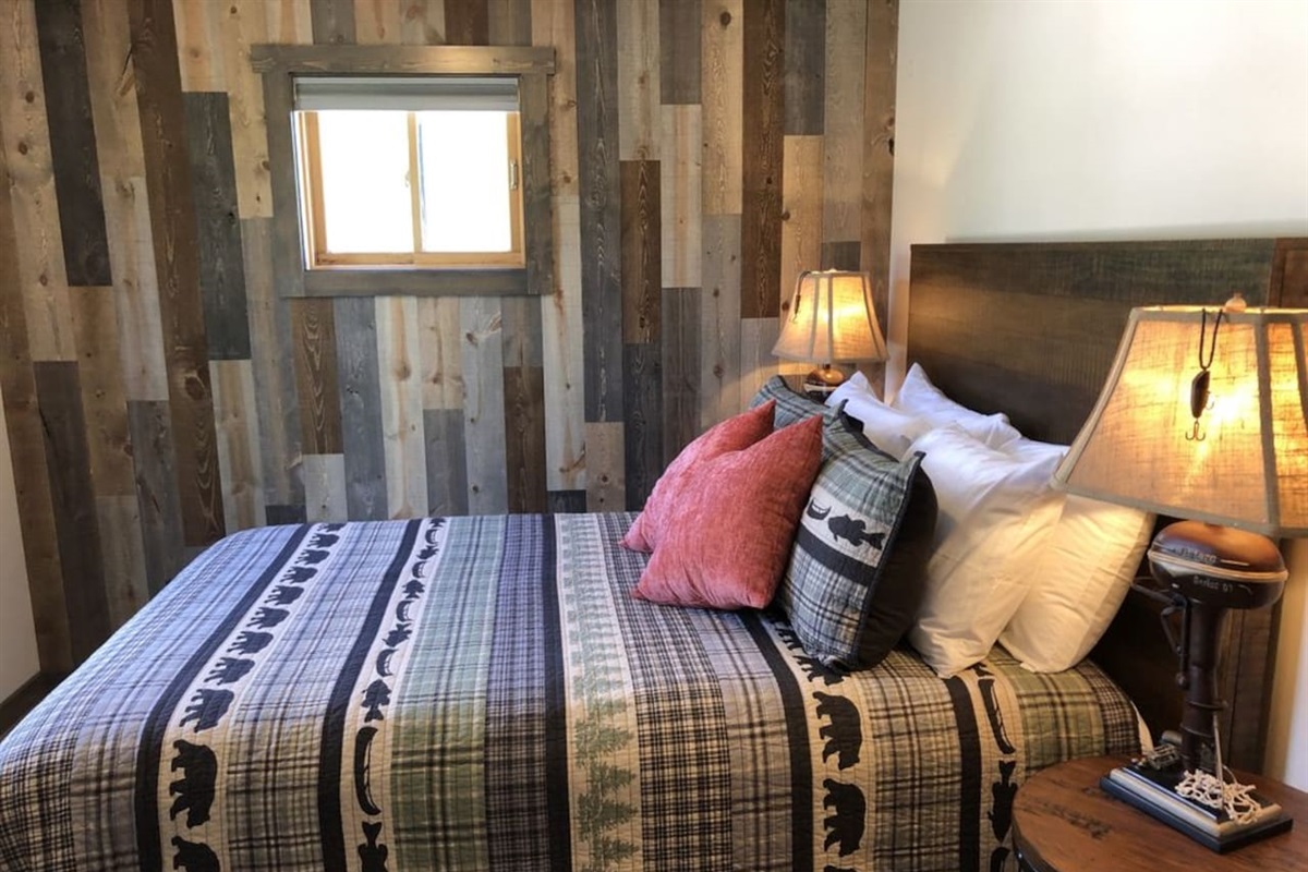 Queen sized bed. Luggage rack and closet with hangers. 