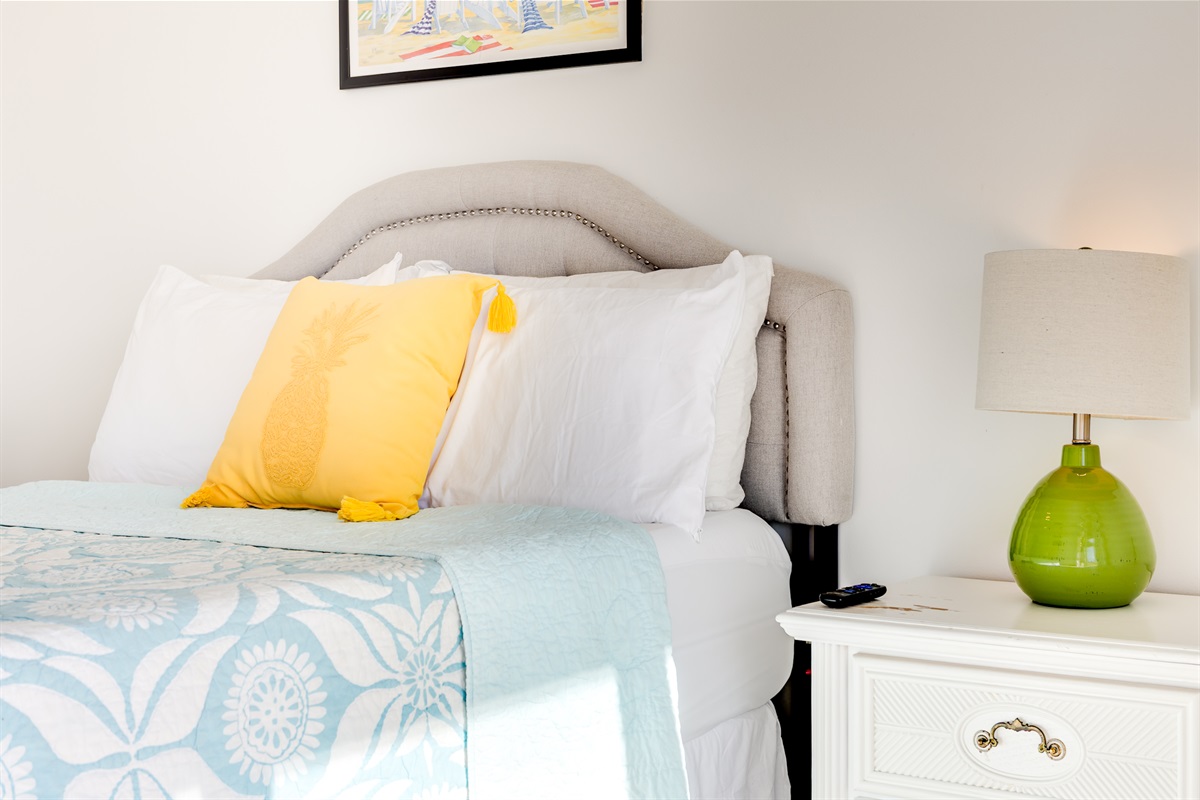Cozy 3rd bedroom with soft bedding, coastal touches, and a peaceful vibe&mdash;perfect for restful nights after long beach days