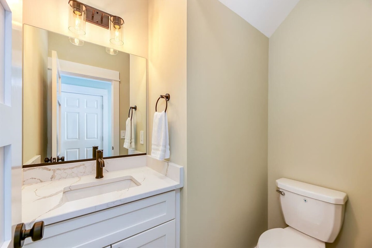 Stylish powder room conveniently located off the common living area.