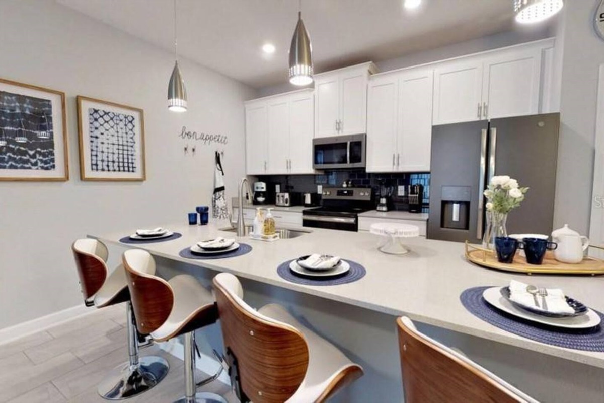 The counter is an island with seating space for 4