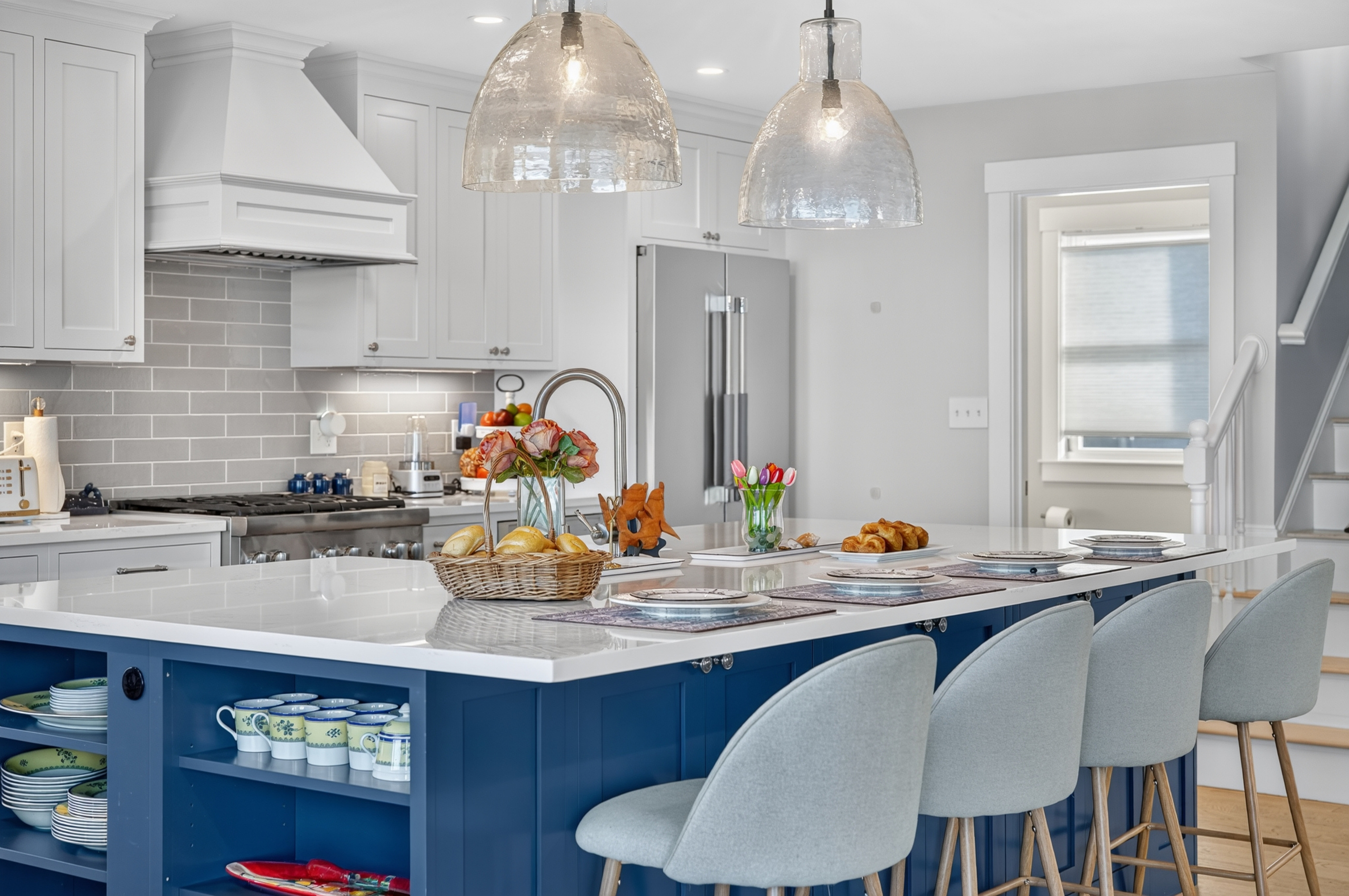 Beautiful chef's kitchen featuring quartz countertops and generous seating for gathering
