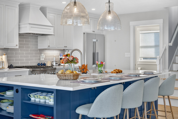 Beautiful chef's kitchen featuring quartz countertops and generous seating for gathering