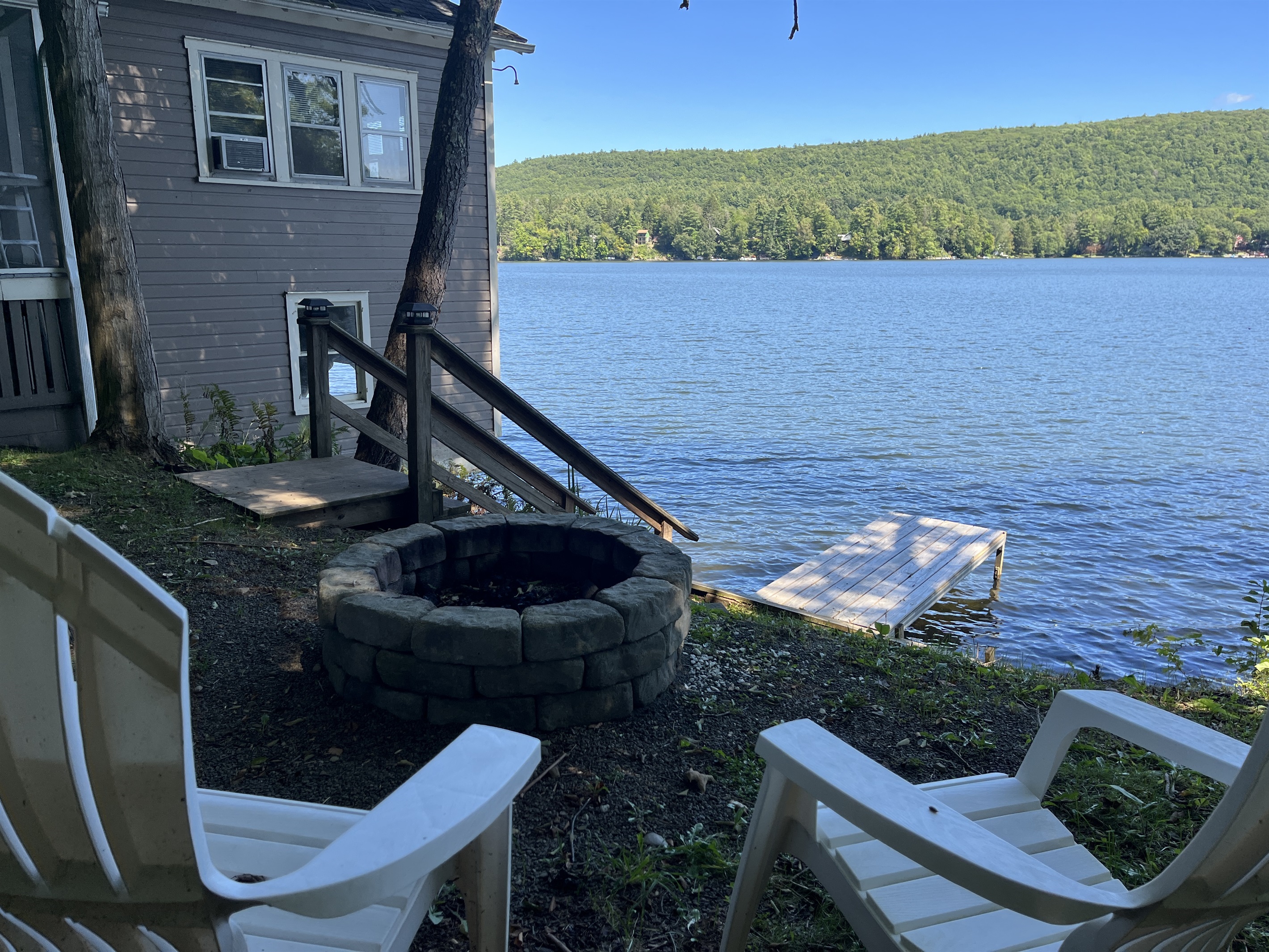 The Boathouse Firepit overlooking the water.