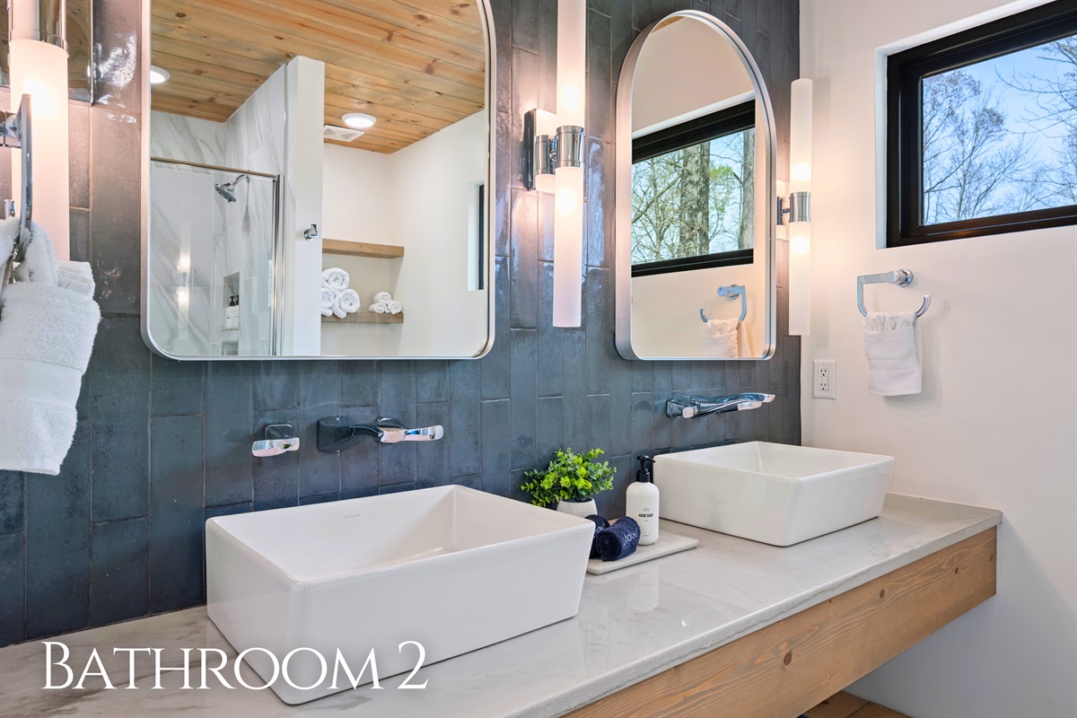 Dual sinks in the bathroom make mornings easier, while the clean design keeps everything feeling fresh and uncluttered.