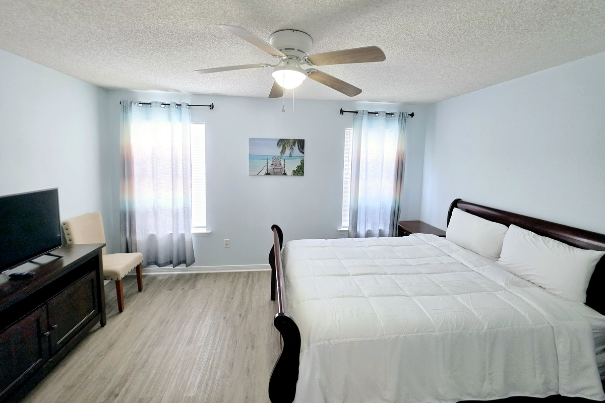 Nest side – Primary bedroom: queen sleigh bed with ensuite bath