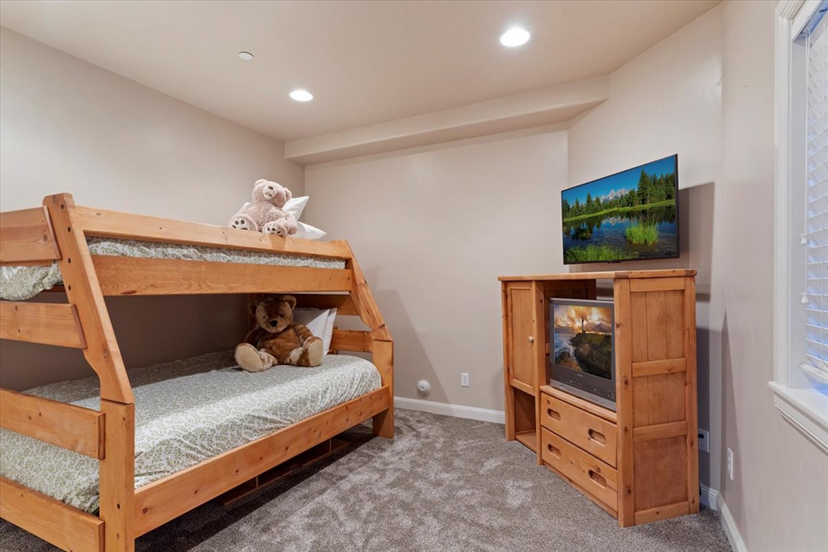 A fun and functional bunk room, perfect for families or groups, offering comfortable sleeping and a welcoming retreat.