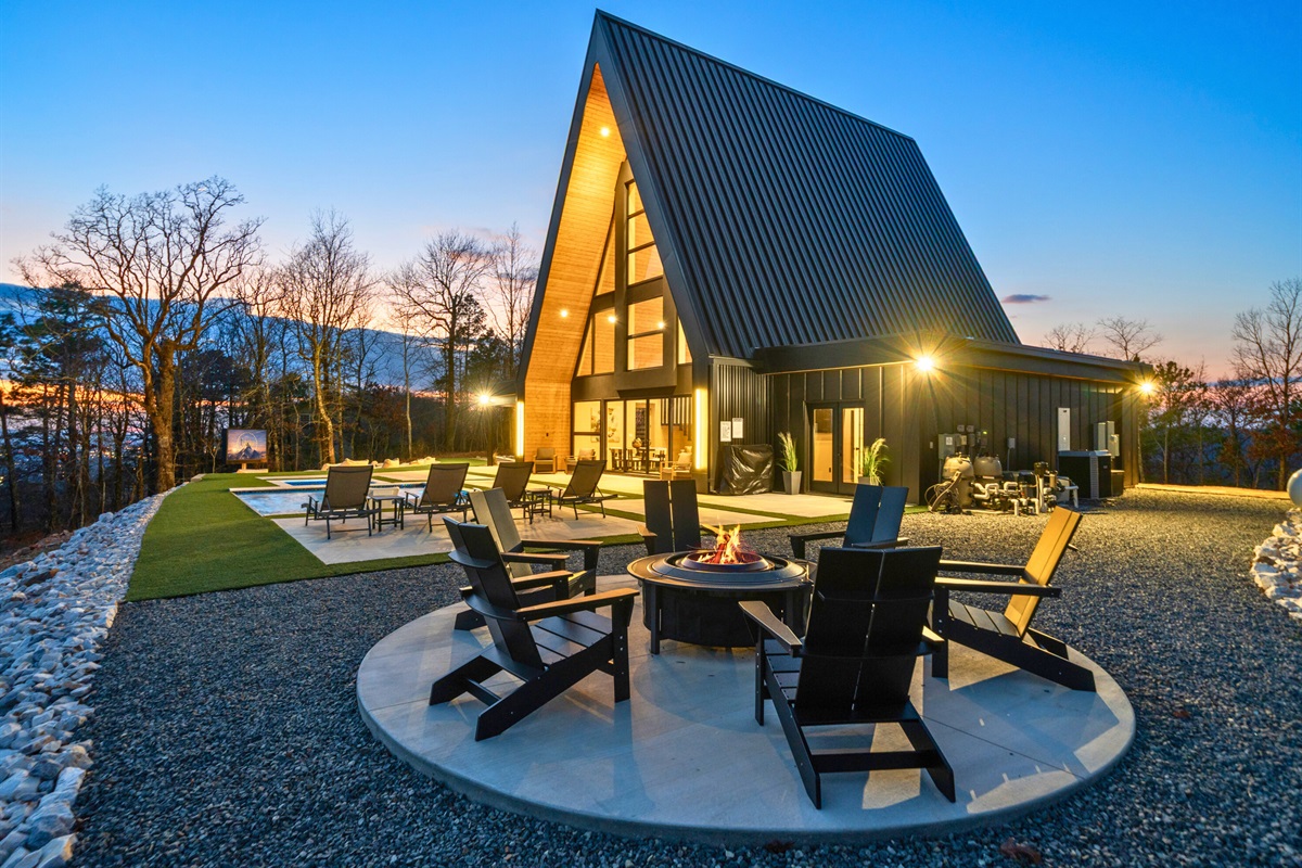 The firepit seating area is ready for golden hour, with plenty of space to gather around, relax, and enjoy the view as the sky changes colors.