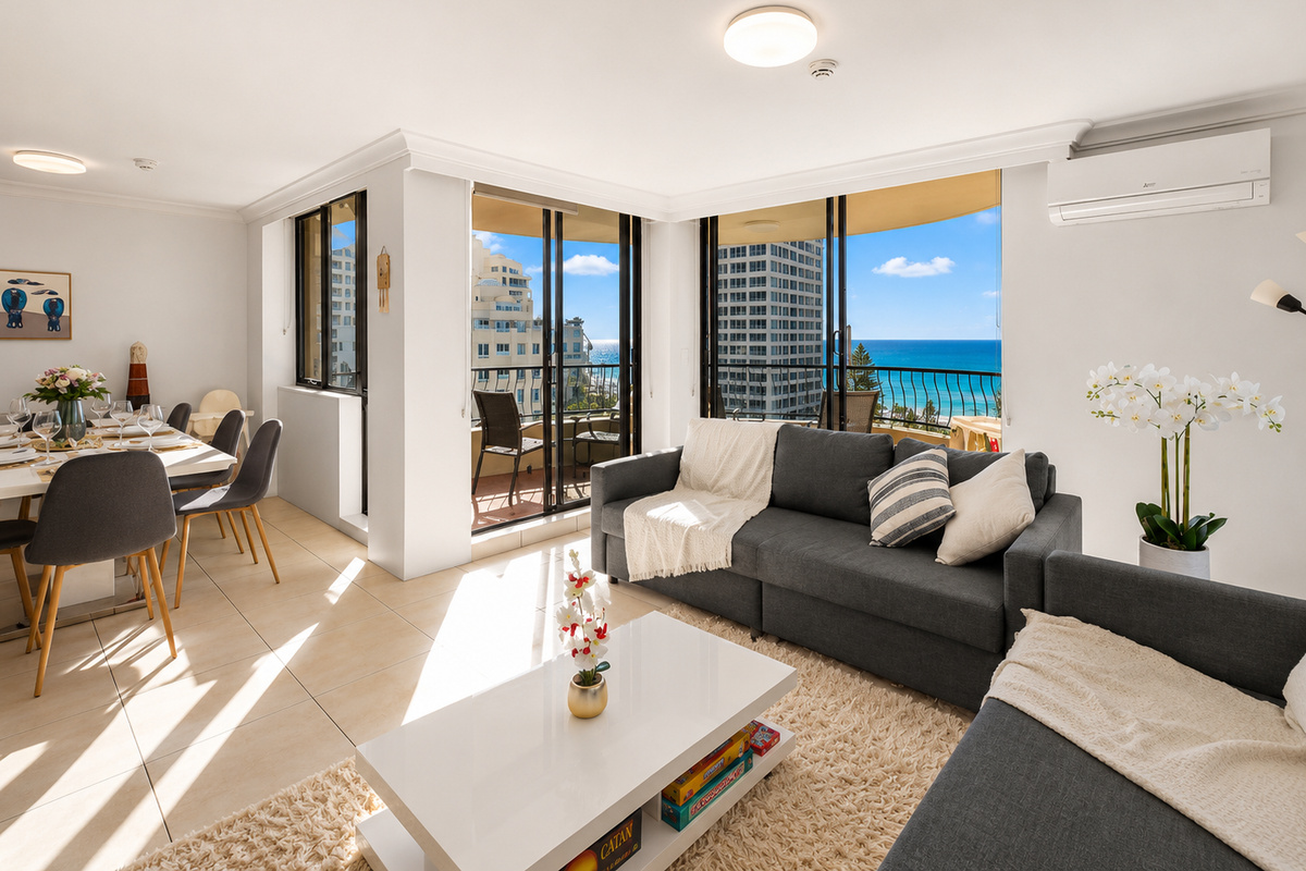 High-rise windows bring city and ocean outlooks into the lounge, adding a clear Gold Coast sense of place to everyday downtime.