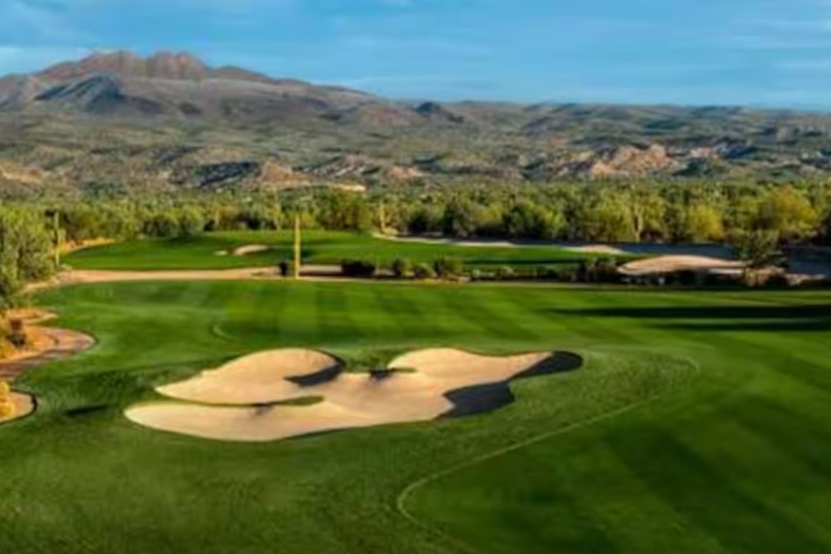 Rolling green fairways stretch toward the mountains, setting a peaceful backdrop for your stay.
