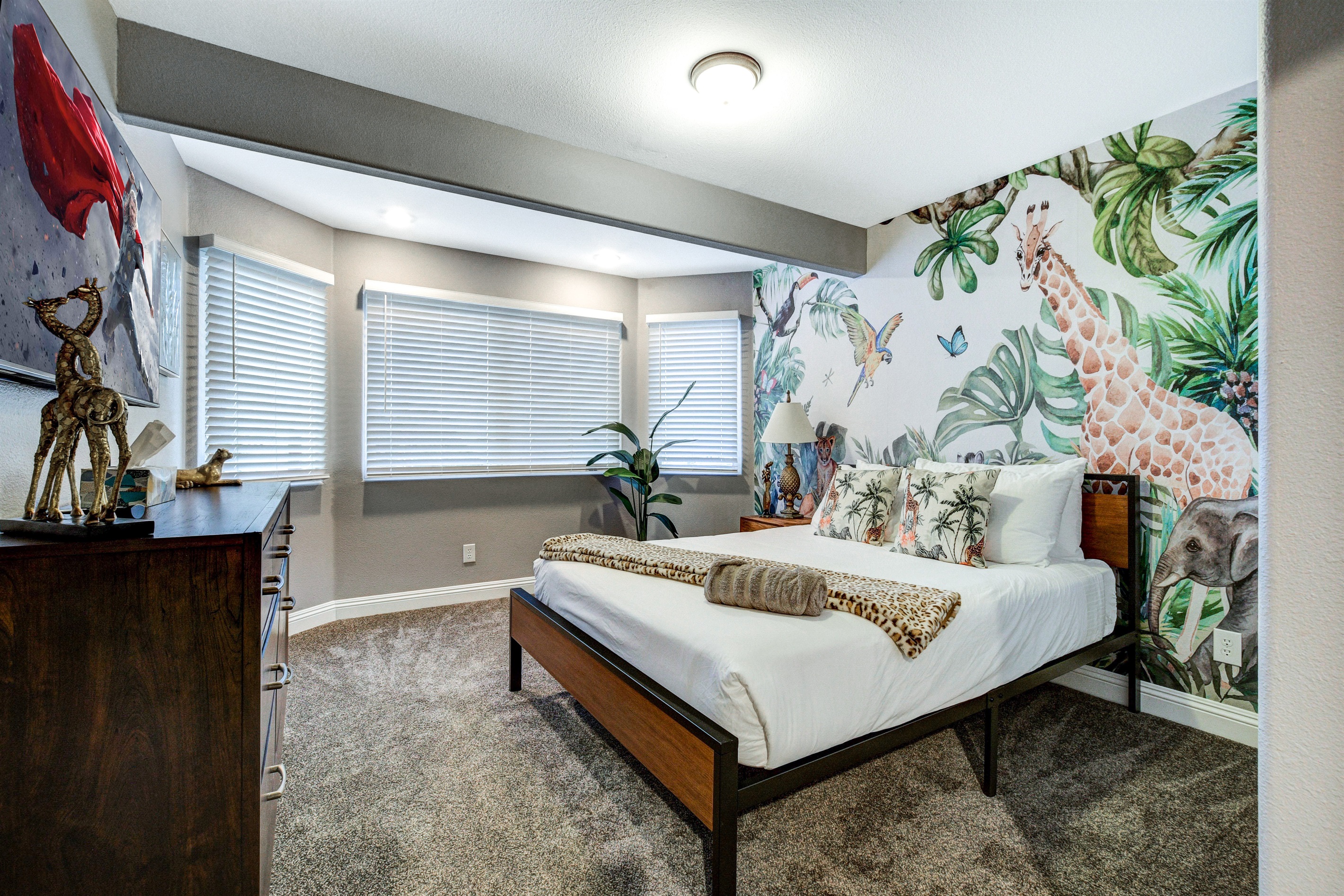 Safari themed bedroom with queen bed.