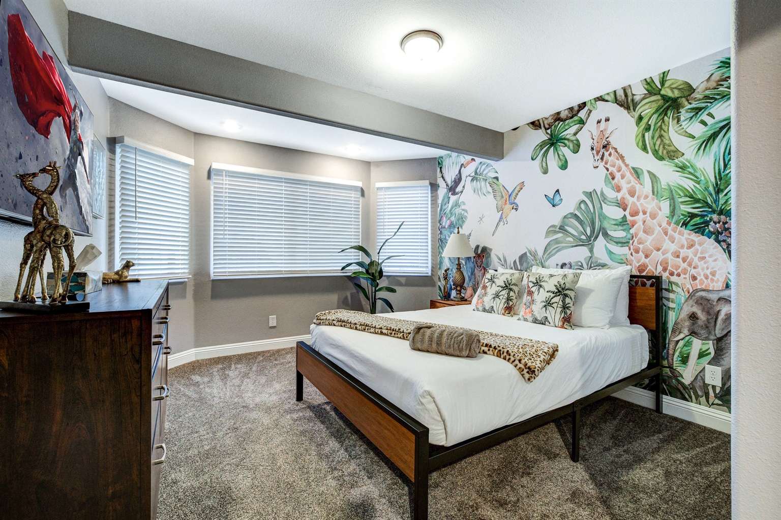 Safari themed bedroom with queen bed.