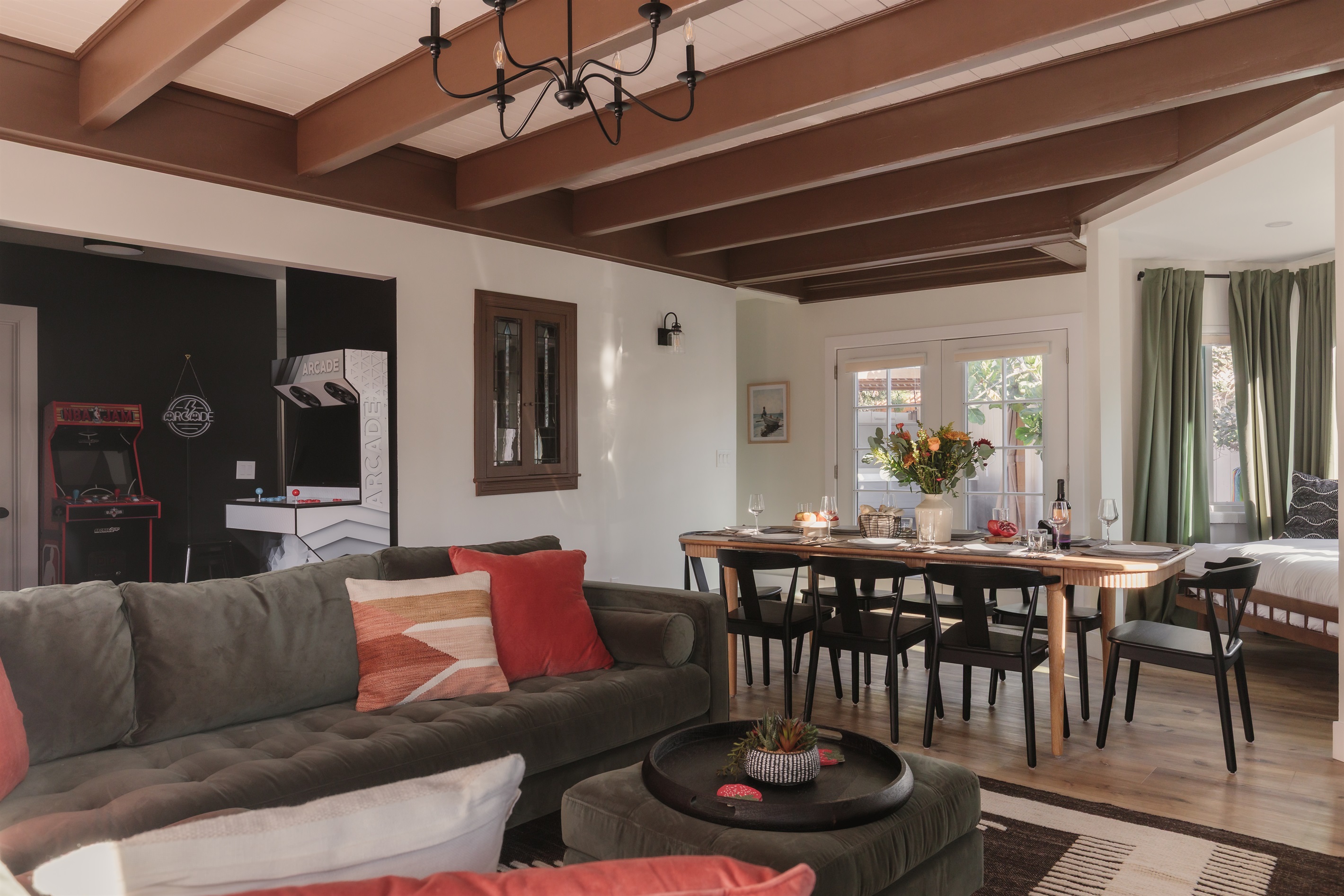 This open-concept space has it all: vintage arcade games, a giant sectional for movie night, and plenty of room for group dinners and laughs.