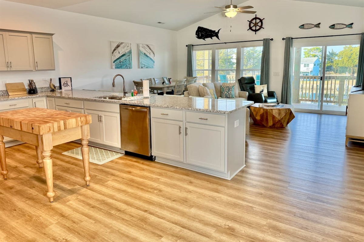 Enjoy cooking in this fully stocked kitchen with a custom island and ample bar seating. 