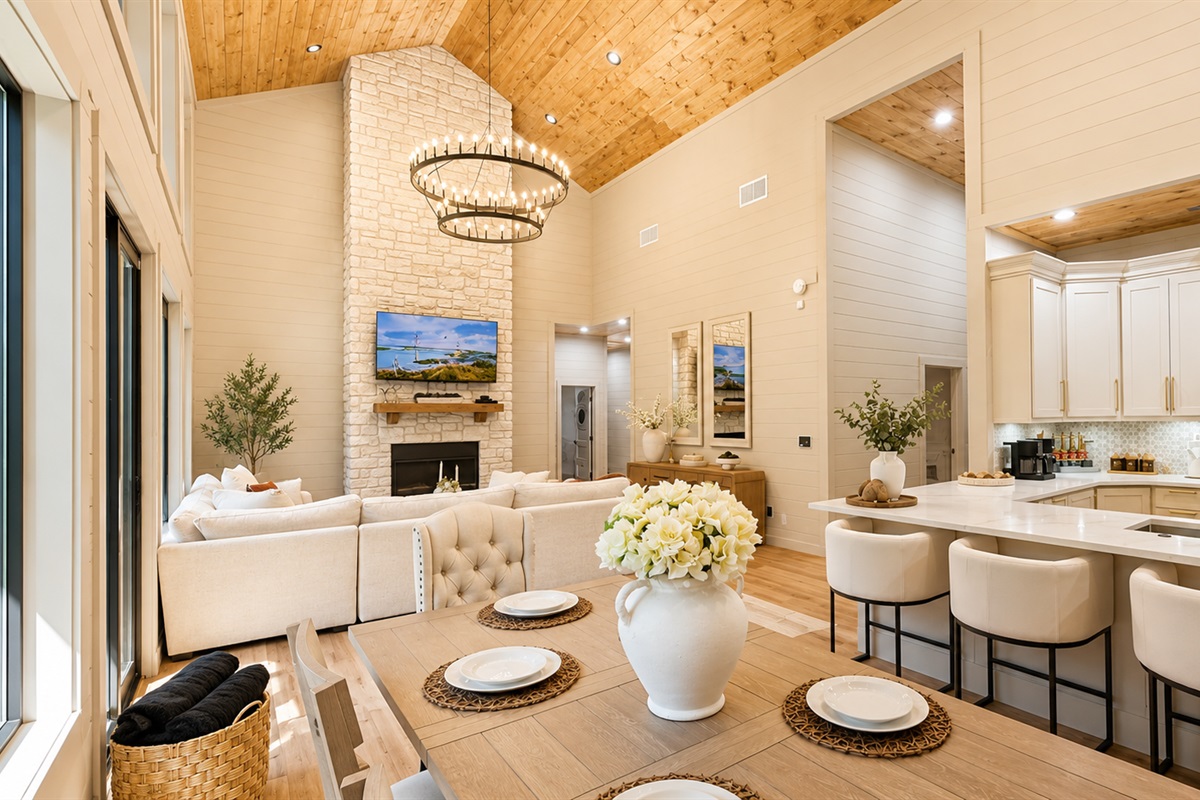 Living Room: Enjoy gatherings under the soaring ceiling and chandelier, with a stunning view!