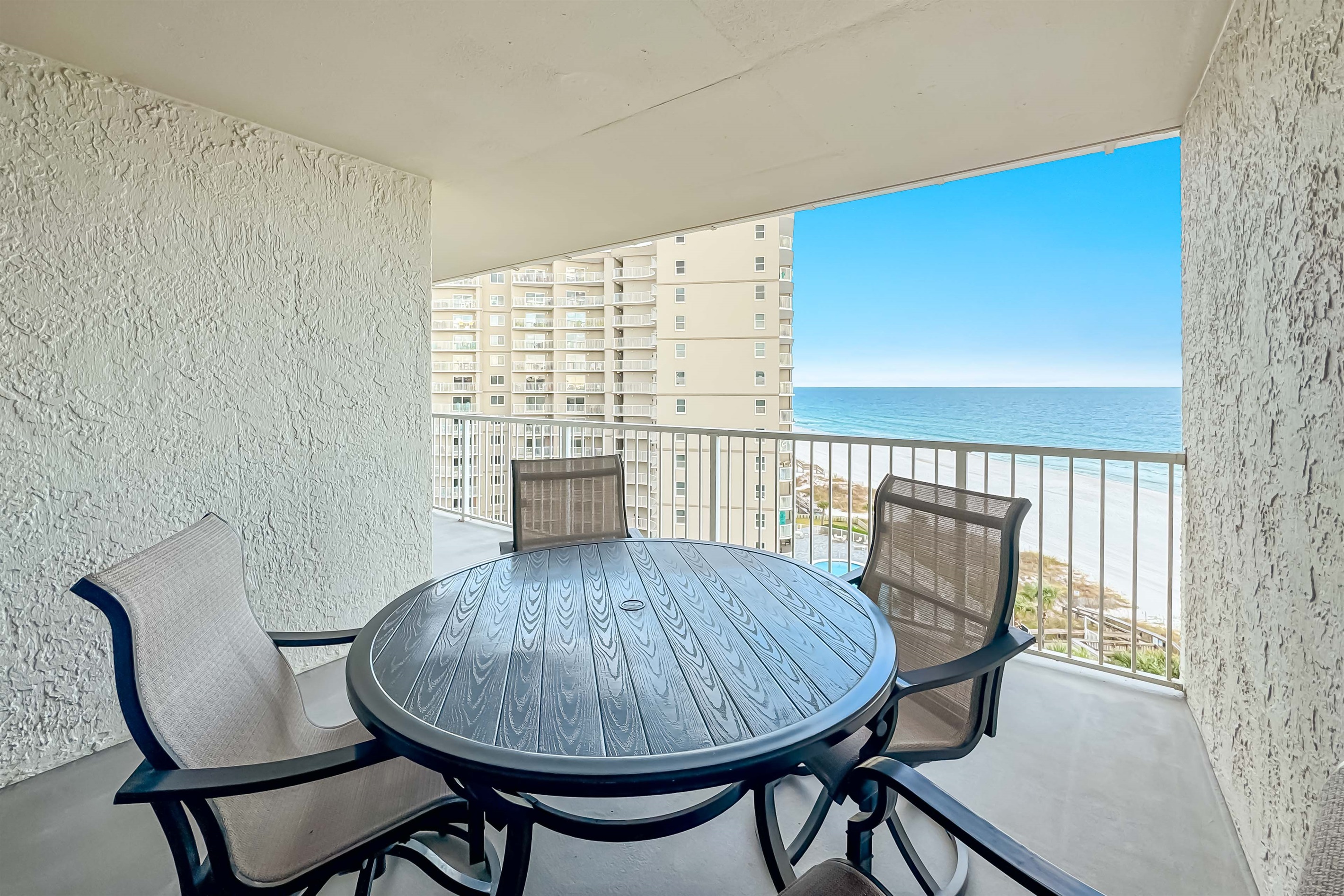 Where the sky meets the sea.  This expansive balcony provides a front-row seat to nature's most spectacular show.  Unwind and recharge in this idyllic setting.