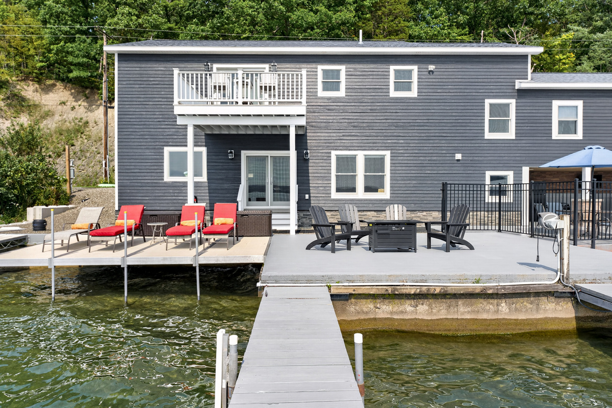 Rear exterior with waterfront decks and dock