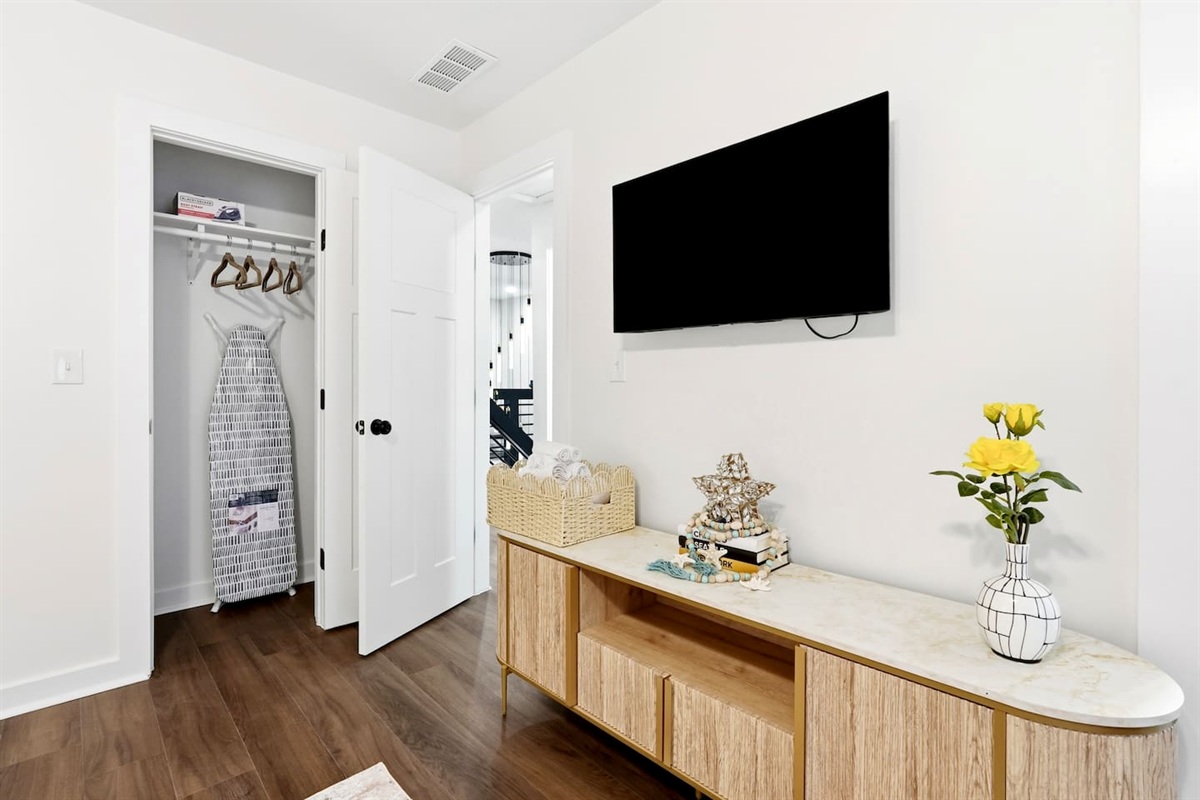 Cozy second-level bedroom featuring a king bed, a Roku-powered Smart TV, and located at the end of the hallway to the left at the top of the staircase. This room includes 2 full-body towels, 2 washcloths, and 2 hand towels for your stay.