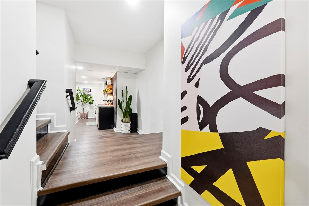 Amazing game room located in the basement, featuring a pool table, foosball table, and a stylish bar perfect for entertaining and relaxing with friends and family.