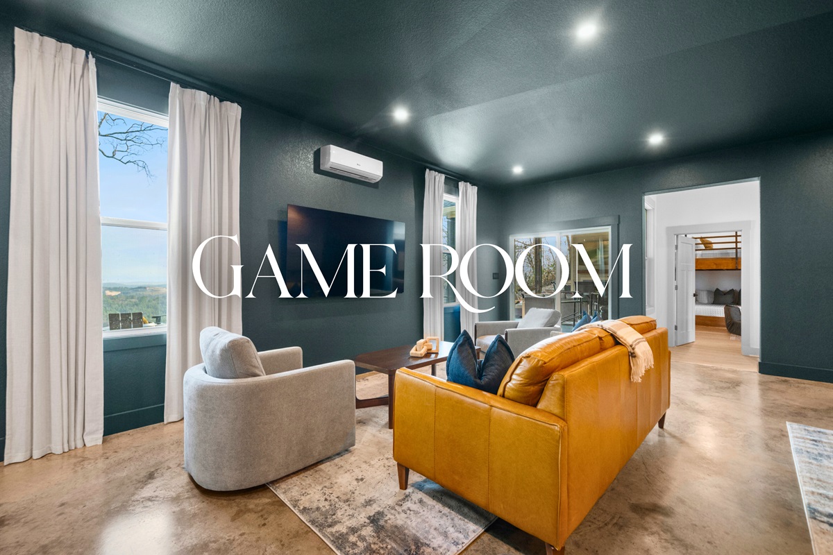 The game room offers a laid-back hangout space with cozy seating and a big-screen setup that&rsquo;s perfect for movie nights or friendly competition.