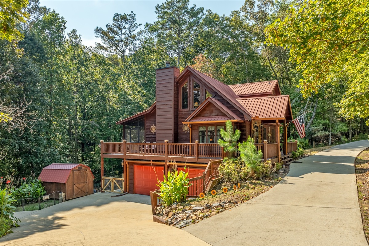 Driveway accessible from both sides for easy and convenient in and out. More parking in front of the garage doors and right next to the little garden area.