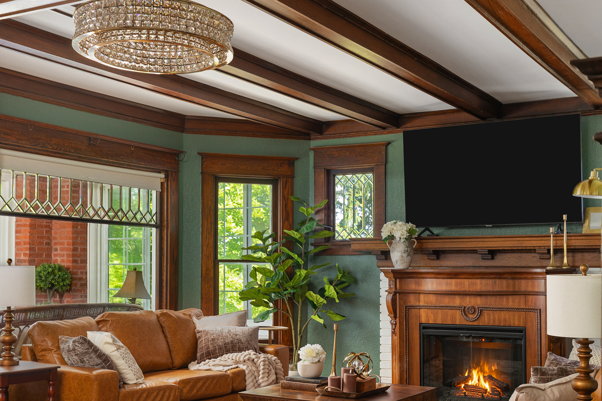 Gather beneath rich wood beams and cozy heritage inspired details in this warm, inviting living room designed for connection and relaxation. Unwind after a great day in a space that feels equal parts timeless and luxurious.