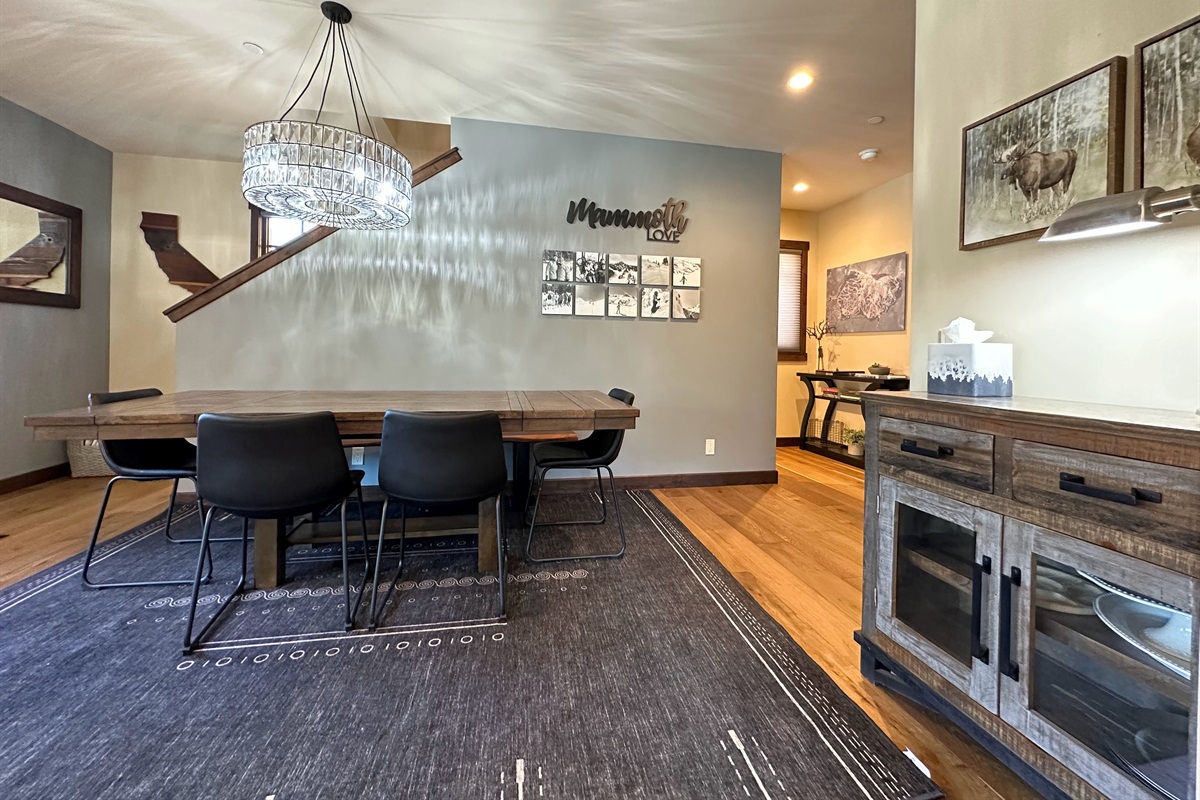 This spacious dining room with a roomy bench table is your go-to spot for shared meals, friendly competitions, or a productive workday—because sometimes, the best ideas happen over good food and great company.