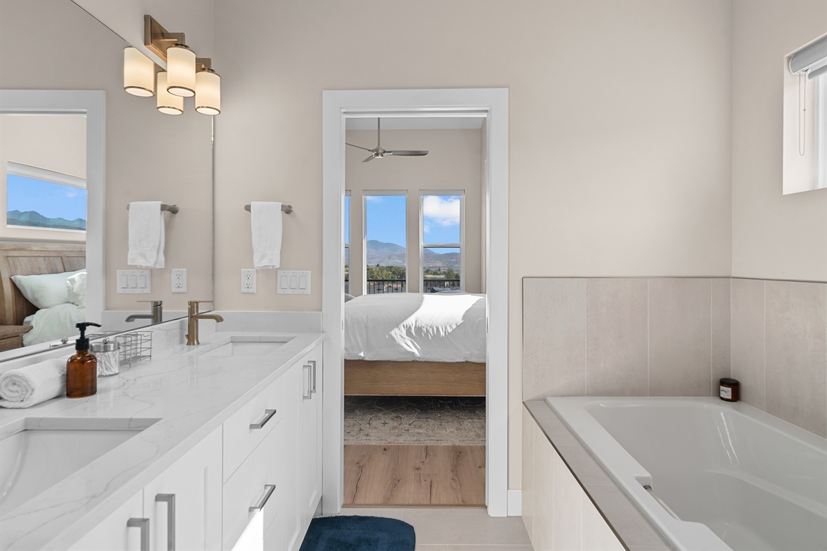 Ensuite bathroom with dual vanities and modern finishes.