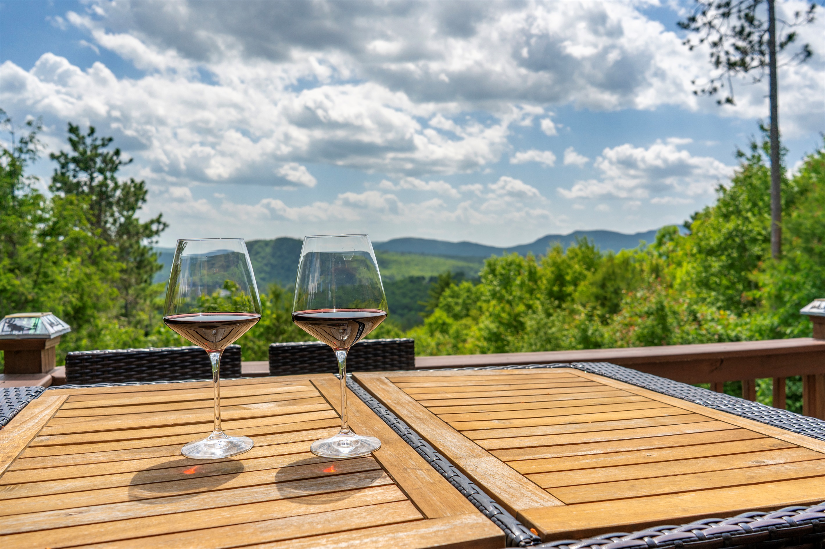 The deck features an outdoor dining area — perfect for sunset dinners or morning coffee."