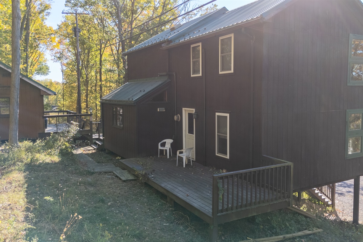 Back view of cabin—convenient chairs on deck, ready for a peaceful stay.