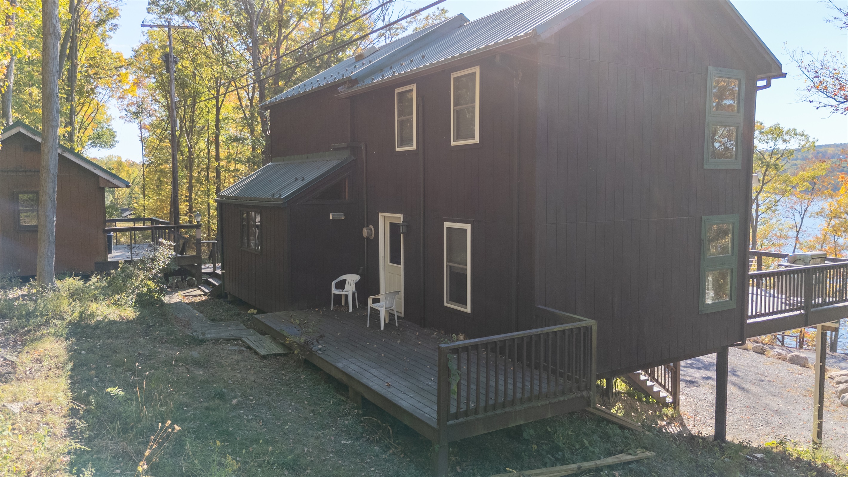 Back view of cabin—convenient chairs on deck, ready for a peaceful stay.