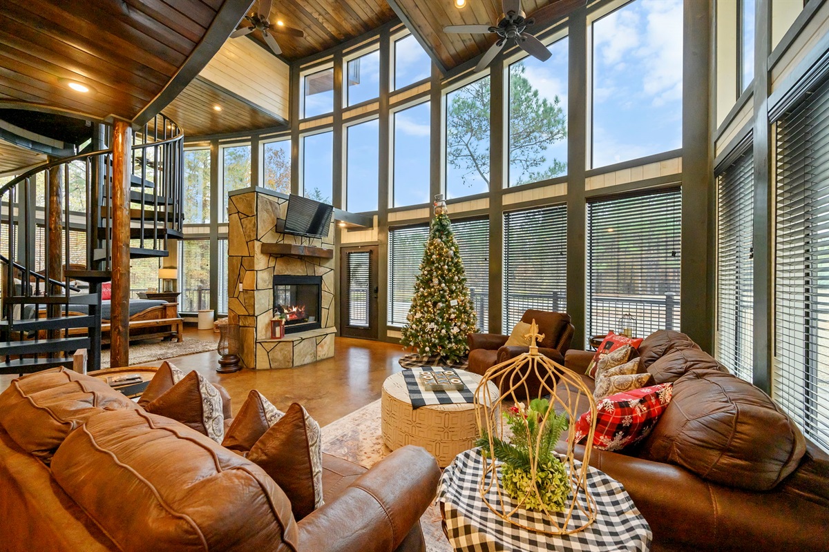 The living room at Round Here Buzz is all comfort and cozy vibes 🌲✨ Sink into the plush seating, enjoy the warm fireplace glow, and unwind in your own peaceful corner of Hochatown. Movie nights and lazy mornings welcome here 💫🕯️ 