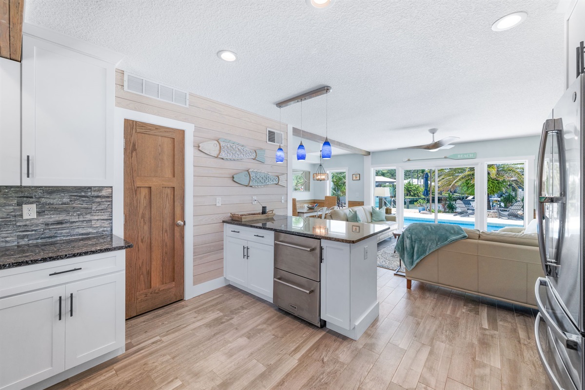 Open kitchen for conversation and view. 