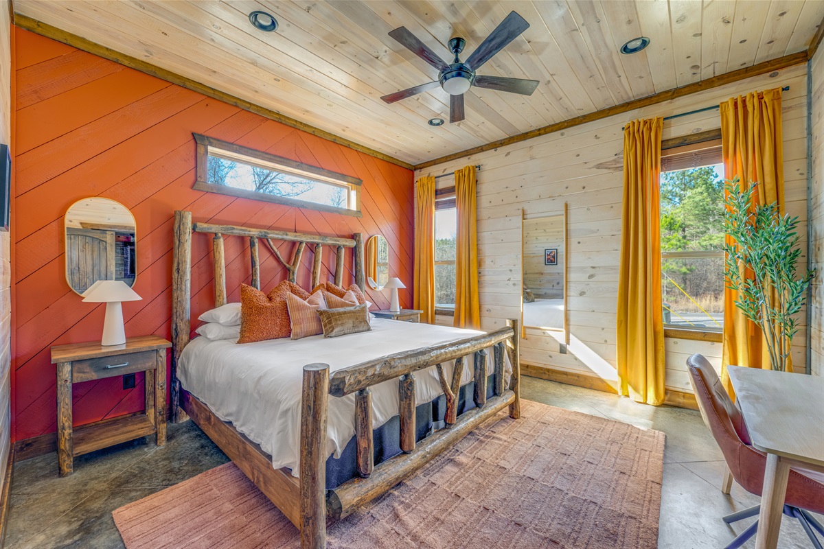 Bedroom Retreat: Experience rustic charm with vibrant decor and natural light in your getaway!