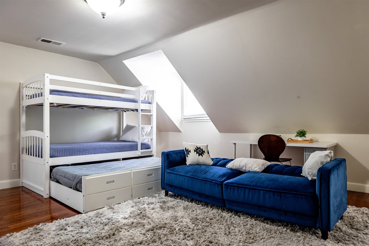 Upstairs bedroom: 3 twins, 1 queen, 1 sofa bed. Desk and TV