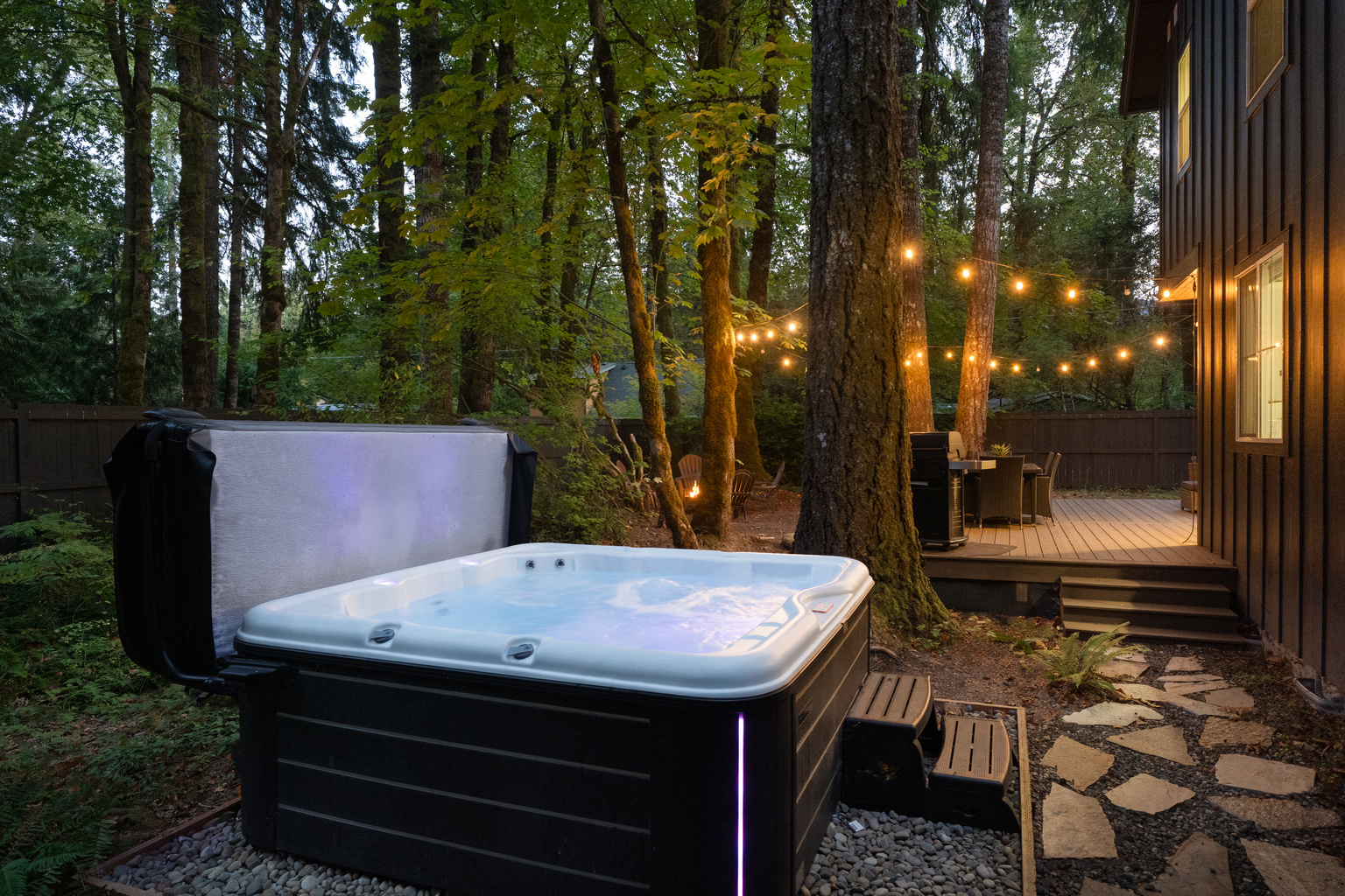 Steam rising, string lights glowing — the hot tub is calling your name.