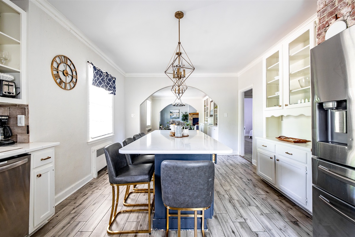Kitchen with island and barstools