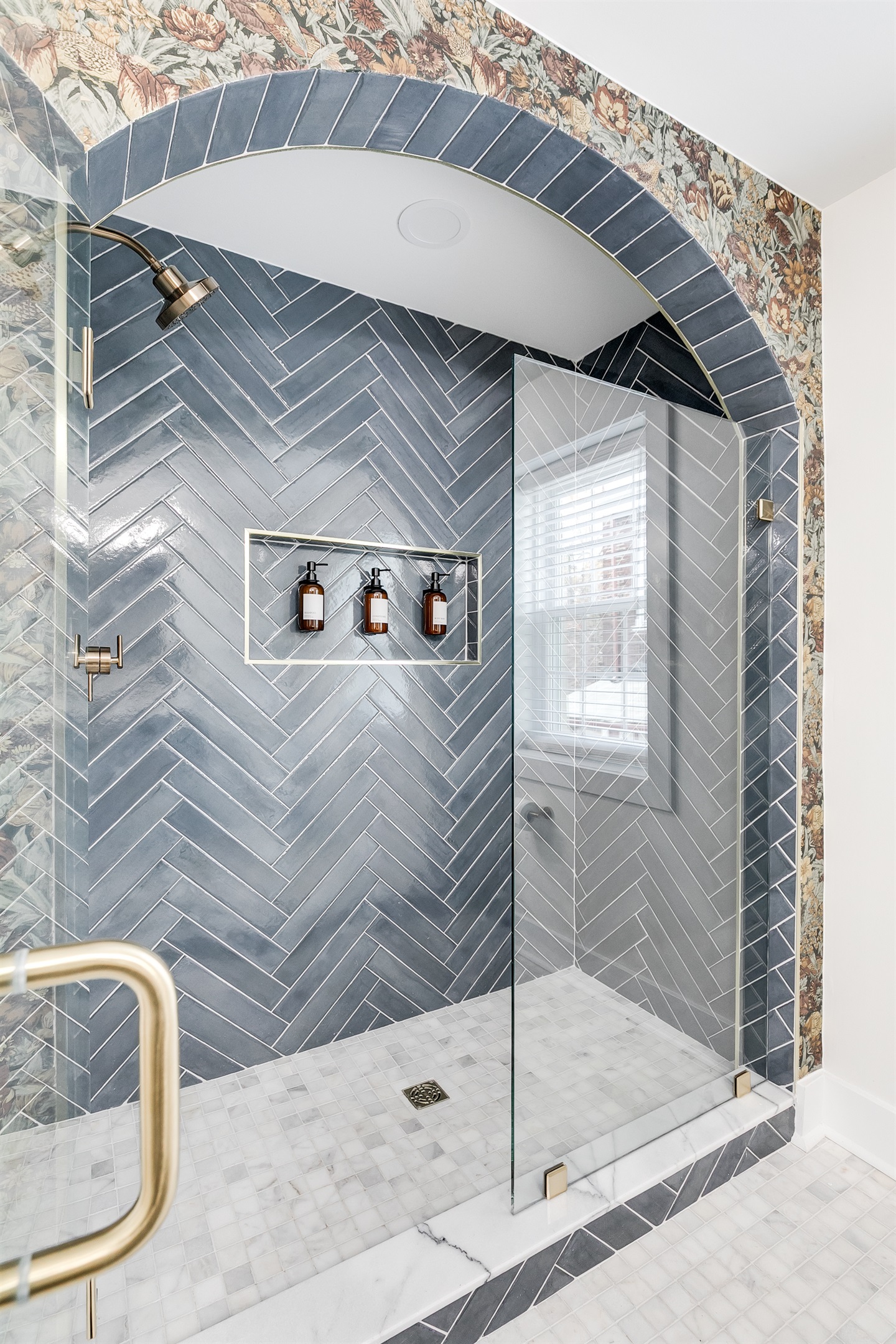 Spa-Like Retreat: Experience luxury with a stunning glass shower and elegant herringbone tiles!