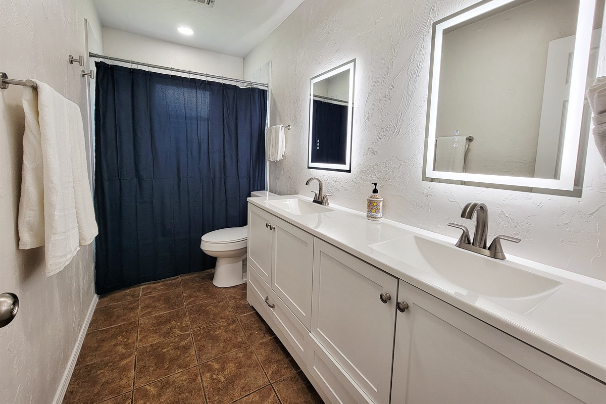 Hallway bathroom with large vanity