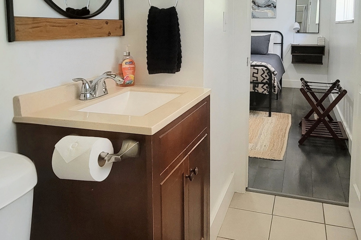 View from bathroom to main bedroom. 