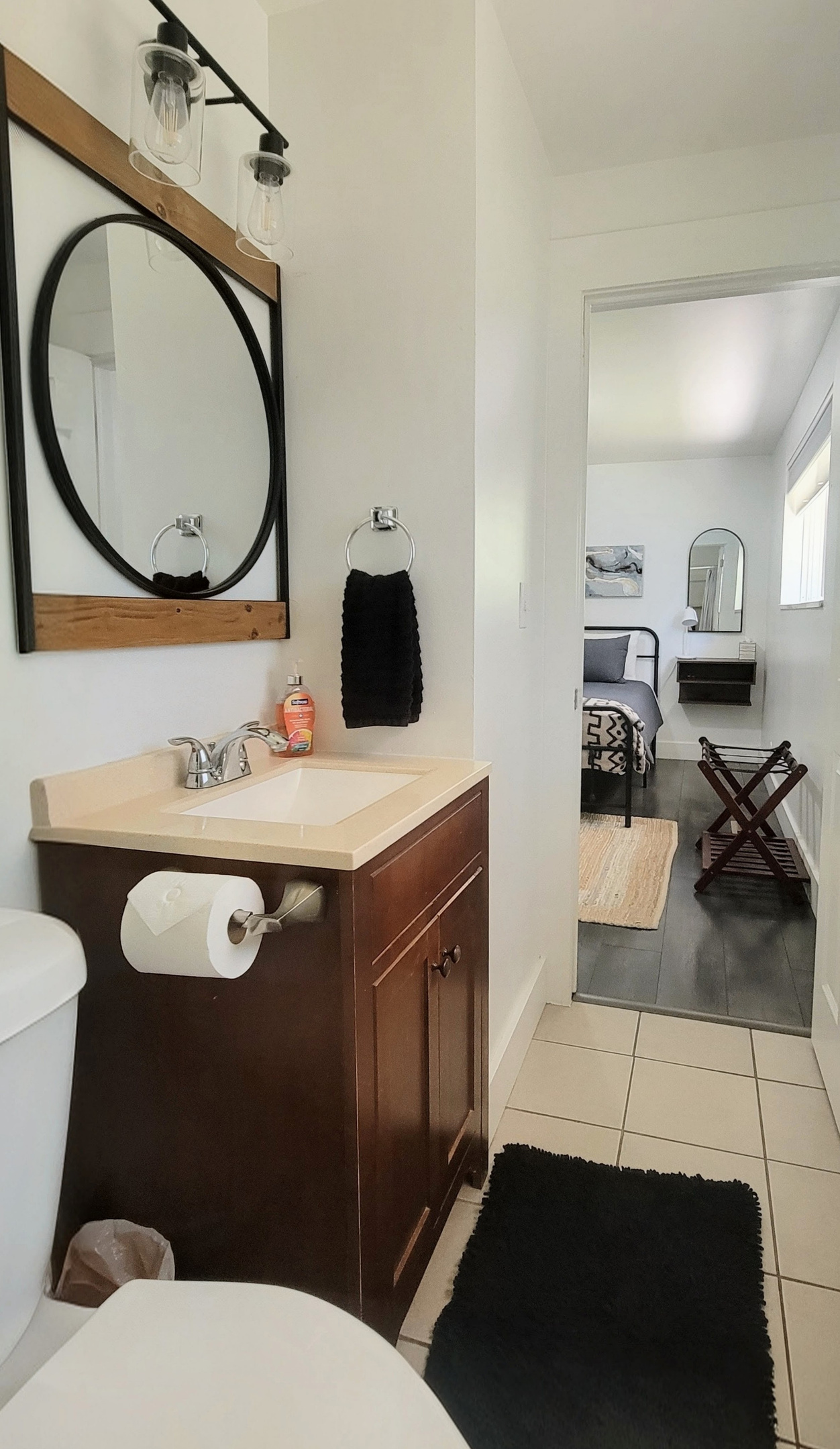 View from bathroom to main bedroom. 