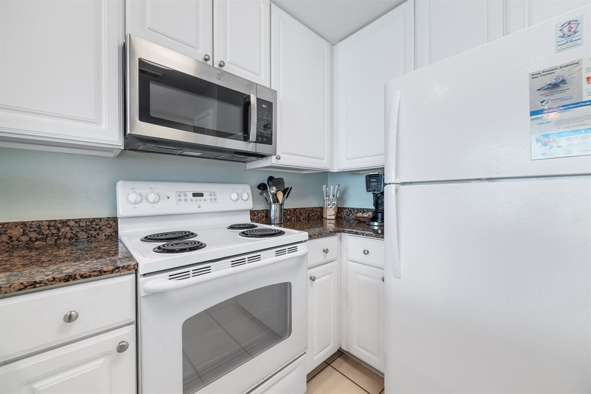 Imagine preparing delicious meals with ease in this well-appointed kitchen, all while staying connected with family and friends in the adjacent living and dining areas. This open-concept design is ideal for a relaxed coastal lifestyle.