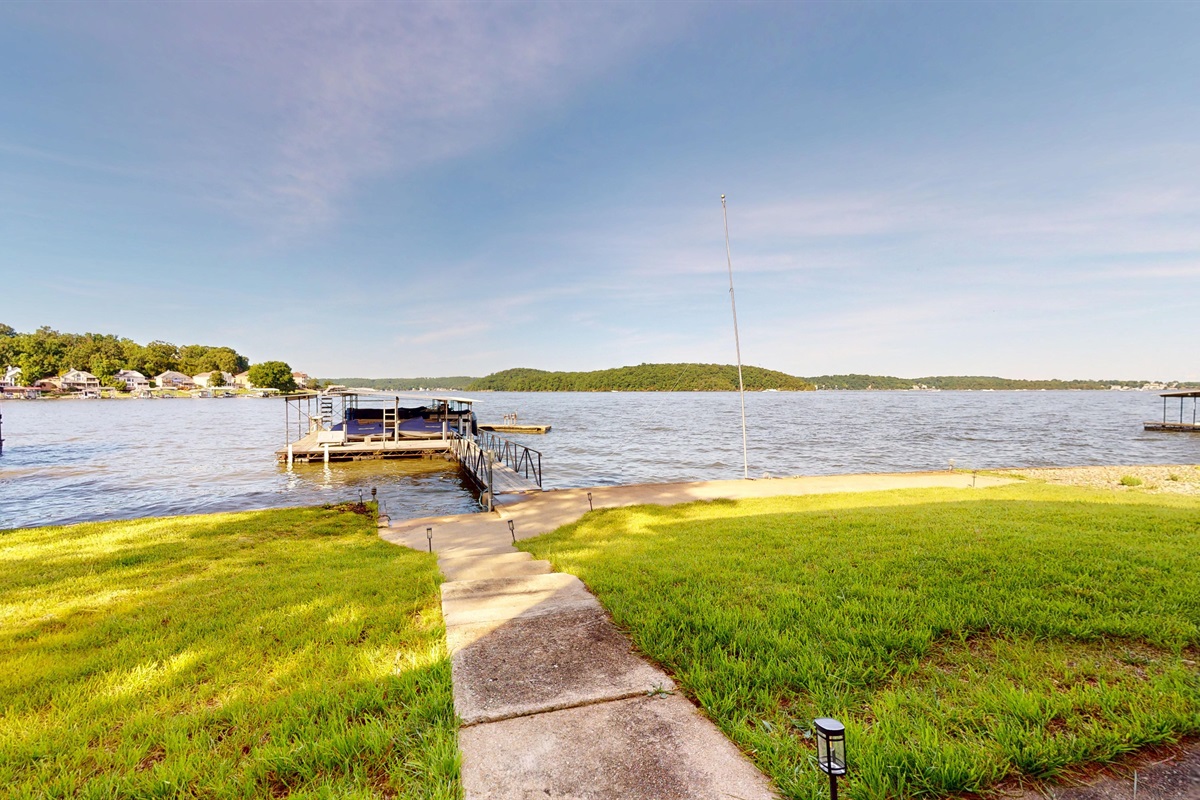 Level lawn between house and dock. Great area for watching boats and enjoying the sun from land.
