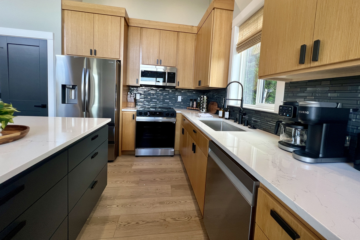 Fully stocked and ready to cook: quartz counters, stainless appliances and a coffee bar to start your mornings right.