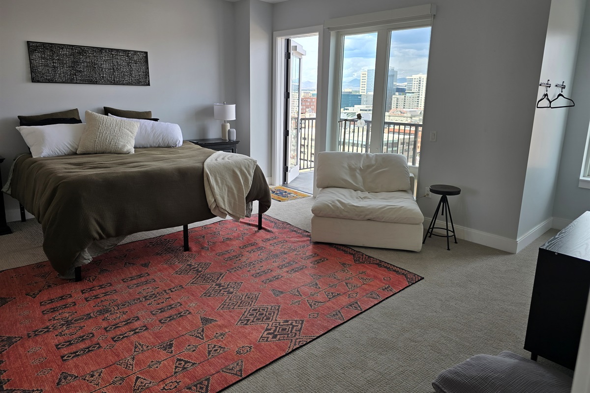 King size bed, extra seating area, private balcony with seating.