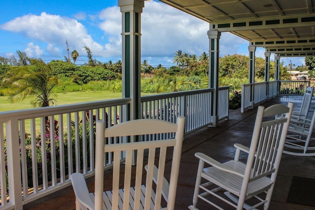 Front porch view with 4 rocking chairs to relax and watch the sunset.